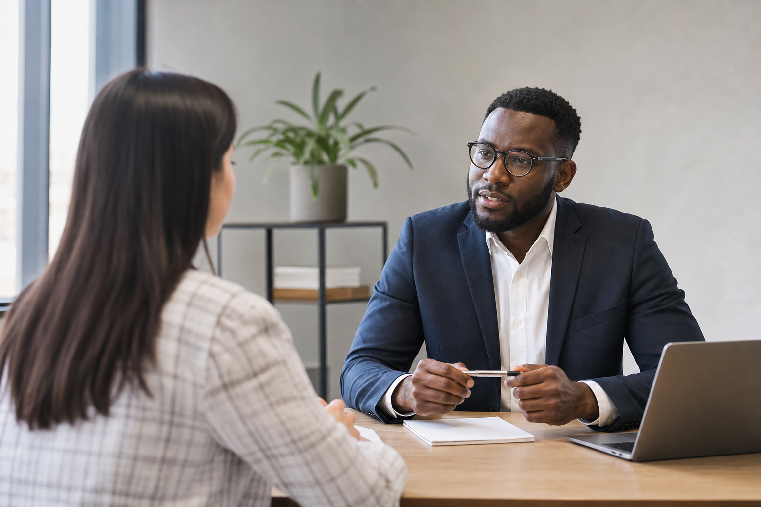 Job Interview Scene with Black Interviewer and Multiracial Interviewee